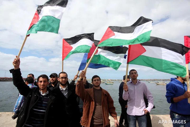Palestinian students take part in a protest demanding for the opening of a waterway between Gaza Strip and other countries, at the Gaza seaport on February 8, 2015. The governmental Committee to Break the Siege on Gaza d...