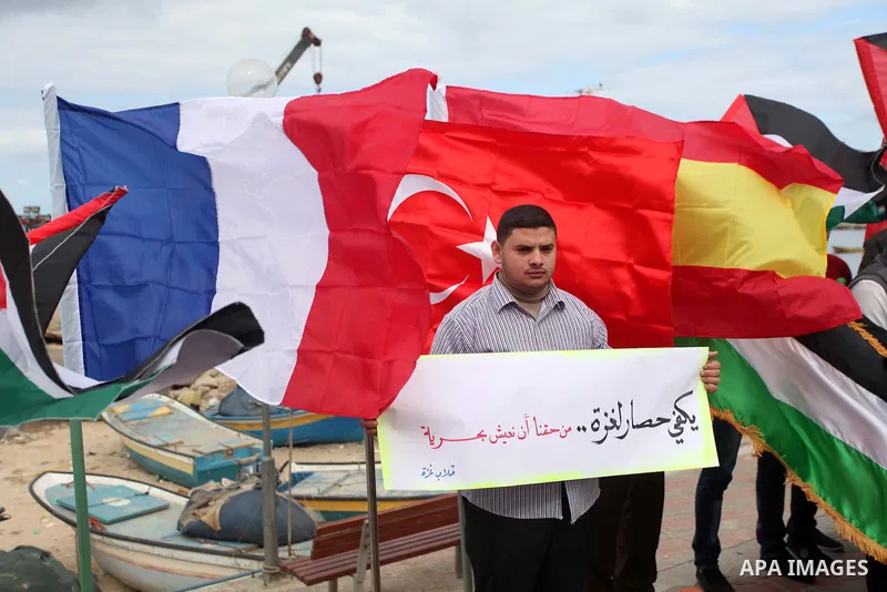 Palestinian students take part in a protest demanding for the opening of a waterway between Gaza Strip and other countries, at the Gaza seaport on February 8, 2015. The governmental Committee to Break the Siege on Gaza d...