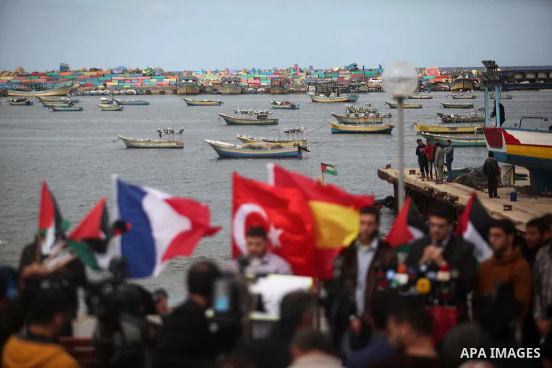 Palestinian students take part in a protest demanding for the opening of a waterway between Gaza Strip and other countries, at the Gaza seaport on February 8, 2015. The governmental Committee to Break the Siege on Gaza d...