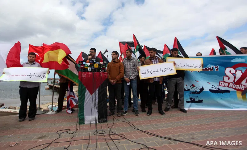 Palestinian students take part in a protest demanding for the opening of a waterway between Gaza Strip and other countries, at the Gaza seaport on February 8, 2015. The governmental Committee to Break the Siege on Gaza d...