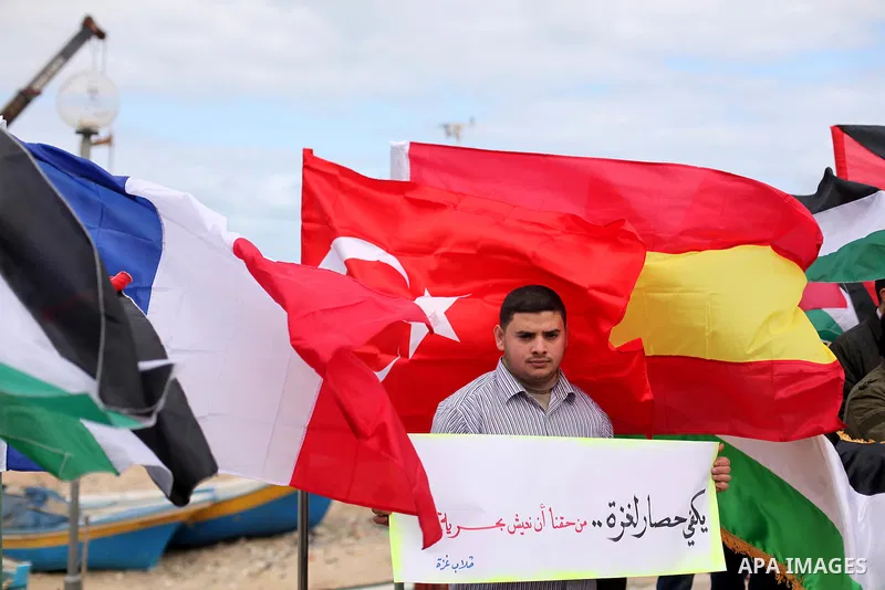 Palestinian students take part in a protest demanding for the opening of a waterway between Gaza Strip and other countries, at the Gaza seaport on February 8, 2015. The governmental Committee to Break the Siege on Gaza d...