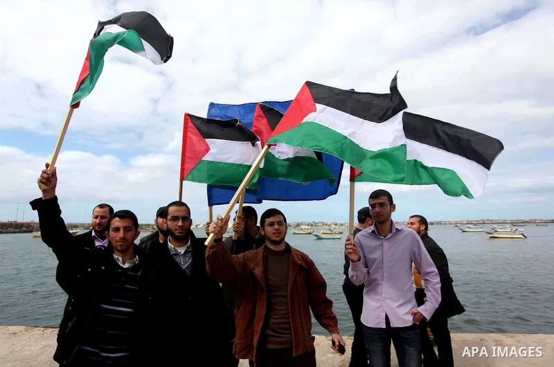 Palestinian students take part in a protest demanding for the opening of a waterway between Gaza Strip and other countries, at the Gaza seaport on February 8, 2015. The governmental Committee to Break the Siege on Gaza d...