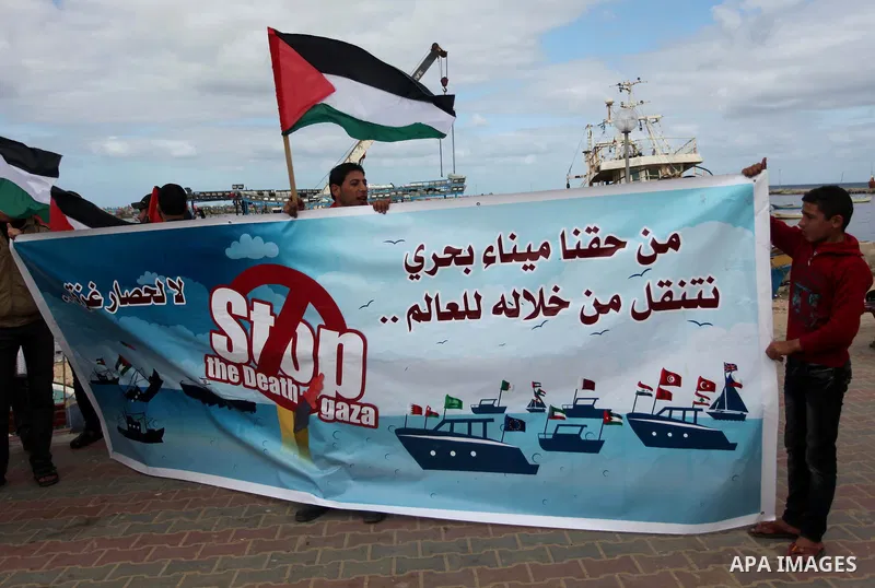 Palestinian students take part in a protest demanding for the opening of a waterway between Gaza Strip and other countries, at the Gaza seaport on February 8, 2015. The governmental Committee to Break the Siege on Gaza d...