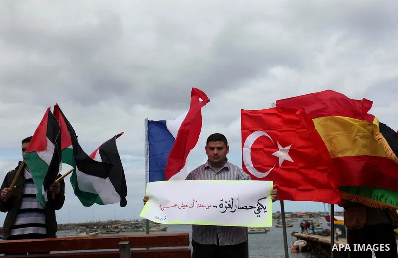 Palestinian students take part in a protest demanding for the opening of a waterway between Gaza Strip and other countries, at the Gaza seaport on February 8, 2015. The governmental Committee to Break the Siege on Gaza d...