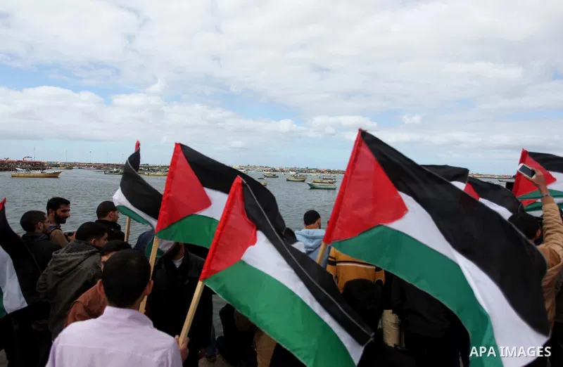 Palestinian students take part in a protest demanding for the opening of a waterway between Gaza Strip and other countries, at the Gaza seaport on February 8, 2015. The governmental Committee to Break the Siege on Gaza d...