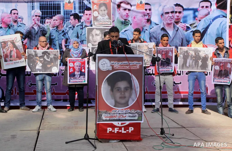 Palestinians take part a protest demanding the release of their relatives prisoners held in Israeli jails, in front of the Red Cross office in Gaza City, on February 9, 2015. Photo by Mohammed Asad