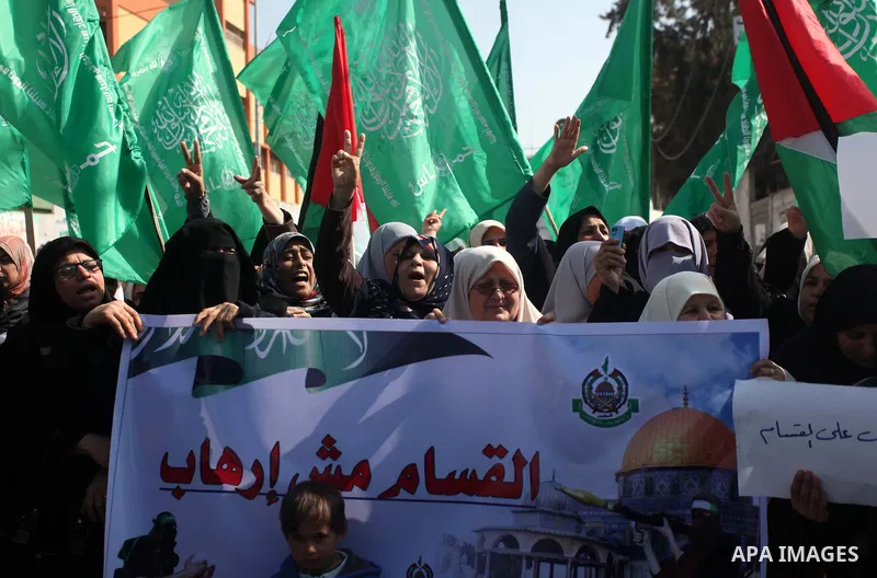 Palestinian women take part in a protest to condemn the decision of an Egyptian court to ban the armed wing of Palestinian Islamist movement, outside the Egyptian embassy in Gaza City February 9, 2015. Since Egypt's mili...