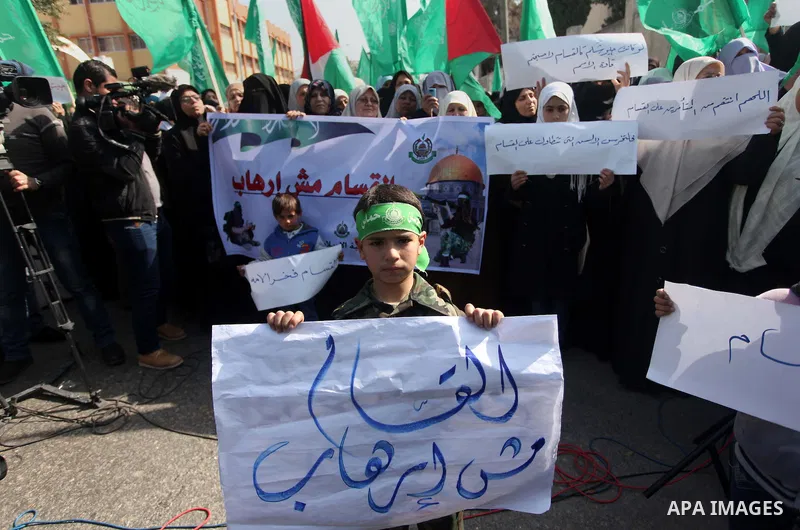 Palestinian women take part in a protest to condemn the decision of an Egyptian court to ban the armed wing of Palestinian Islamist movement, outside the Egyptian embassy in Gaza City February 9, 2015. Since Egypt's mili...