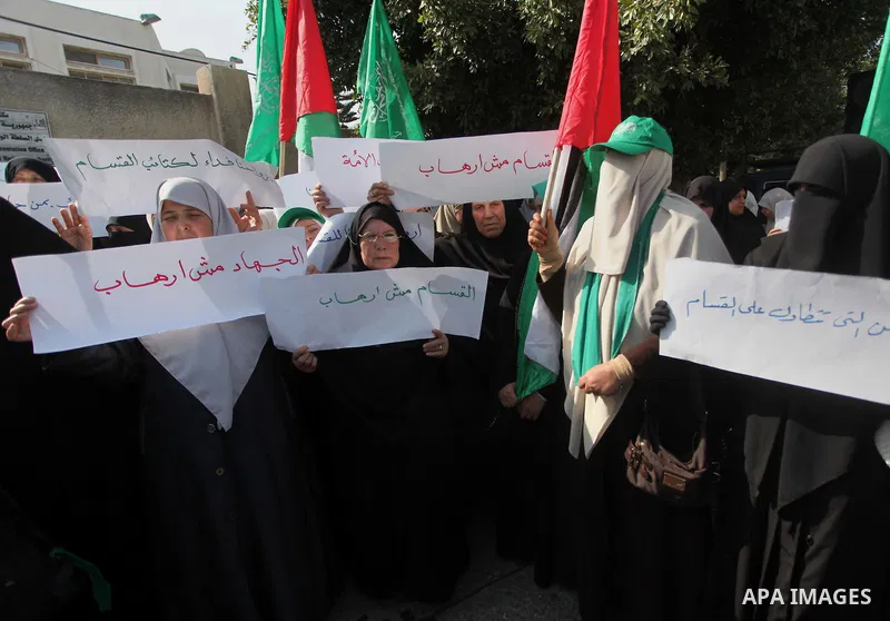 Palestinian women take part in a protest to condemn the decision of an Egyptian court to ban the armed wing of Palestinian Islamist movement, outside the Egyptian embassy in Gaza City February 9, 2015. Since Egypt's mili...