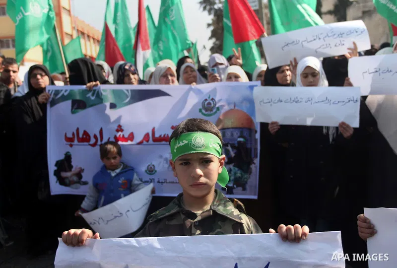 Palestinian women take part in a protest to condemn the decision of an Egyptian court to ban the armed wing of Palestinian Islamist movement, outside the Egyptian embassy in Gaza City February 9, 2015. Since Egypt's mili...