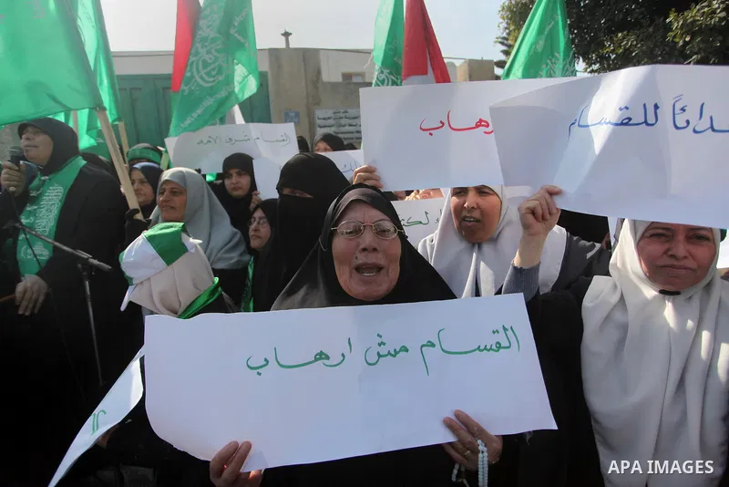 Palestinian women take part in a protest to condemn the decision of an Egyptian court to ban the armed wing of Palestinian Islamist movement, outside the Egyptian embassy in Gaza City February 9, 2015. Since Egypt's mili...