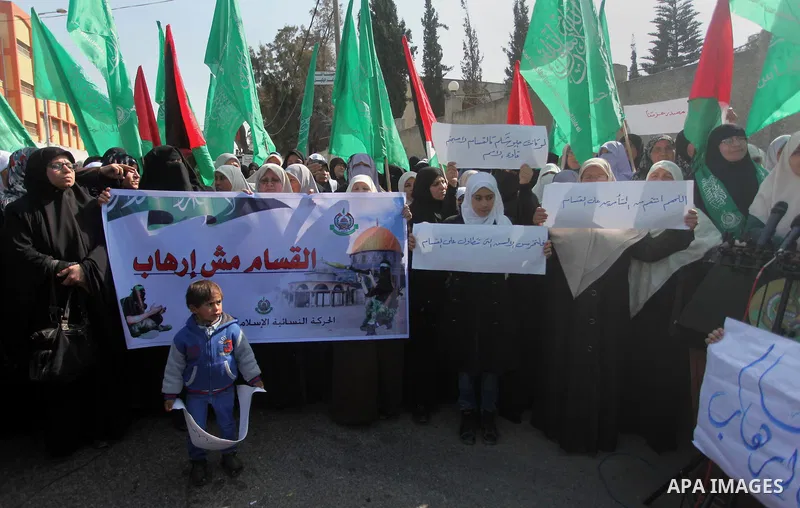 Palestinian women take part in a protest to condemn the decision of an Egyptian court to ban the armed wing of Palestinian Islamist movement, outside the Egyptian embassy in Gaza City February 9, 2015. Since Egypt's mili...