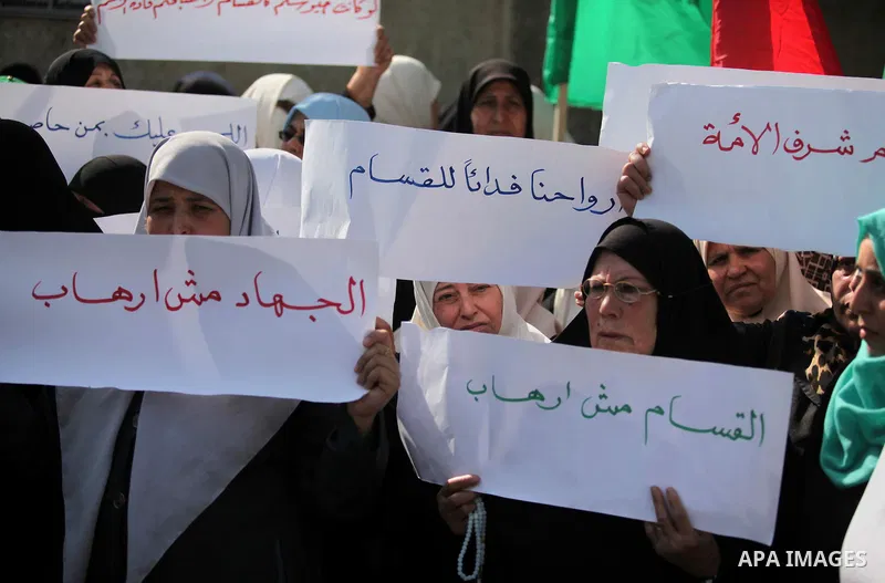 Palestinian women take part in a protest to condemn the decision of an Egyptian court to ban the armed wing of Palestinian Islamist movement, outside the Egyptian embassy in Gaza City February 9, 2015. Since Egypt's mili...