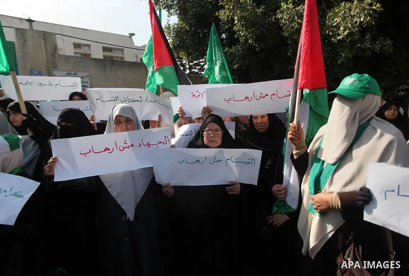 Palestinian women take part in a protest to condemn the decision of an Egyptian court to ban the armed wing of Palestinian Islamist movement, outside the Egyptian embassy in Gaza City February 9, 2015. Since Egypt's mili...