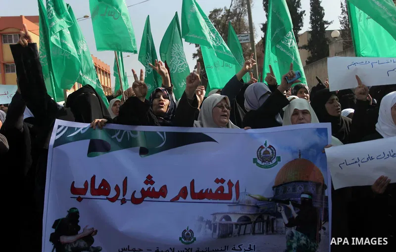 Palestinian women take part in a protest to condemn the decision of an Egyptian court to ban the armed wing of Palestinian Islamist movement, outside the Egyptian embassy in Gaza City February 9, 2015. Since Egypt's mili...