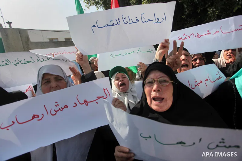Palestinian women take part in a protest to condemn the decision of an Egyptian court to ban the armed wing of Palestinian Islamist movement, outside the Egyptian embassy in Gaza City February 9, 2015. Since Egypt's mili...