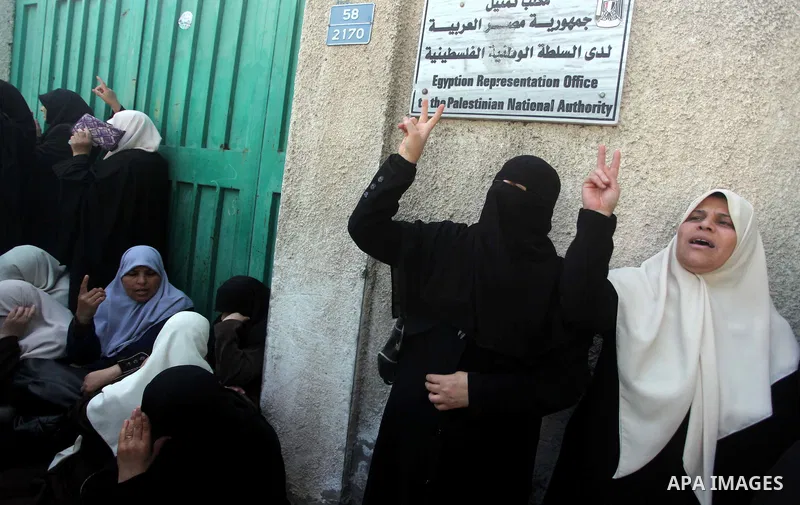 Palestinian women take part in a protest to condemn the decision of an Egyptian court to ban the armed wing of Palestinian Islamist movement, outside the Egyptian embassy in Gaza City February 9, 2015. Since Egypt's mili...