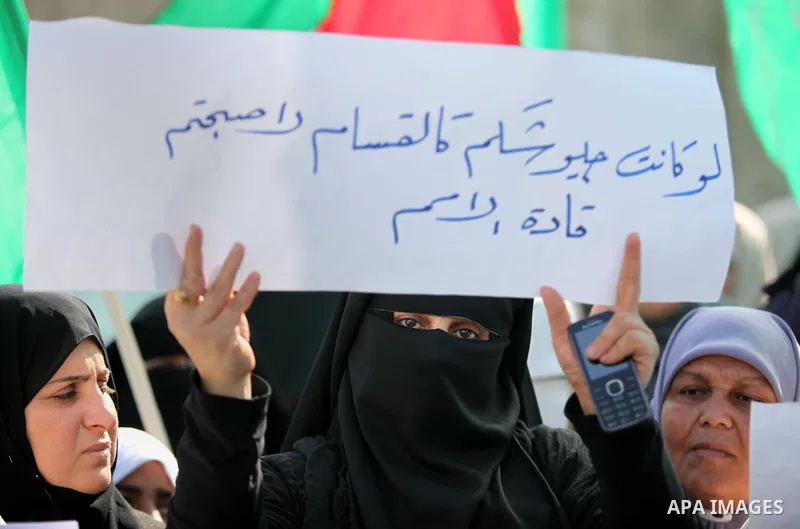 Palestinian women take part in a protest to condemn the decision of an Egyptian court to ban the armed wing of Palestinian Islamist movement, outside the Egyptian embassy in Gaza City February 9, 2015. Since Egypt's mili...