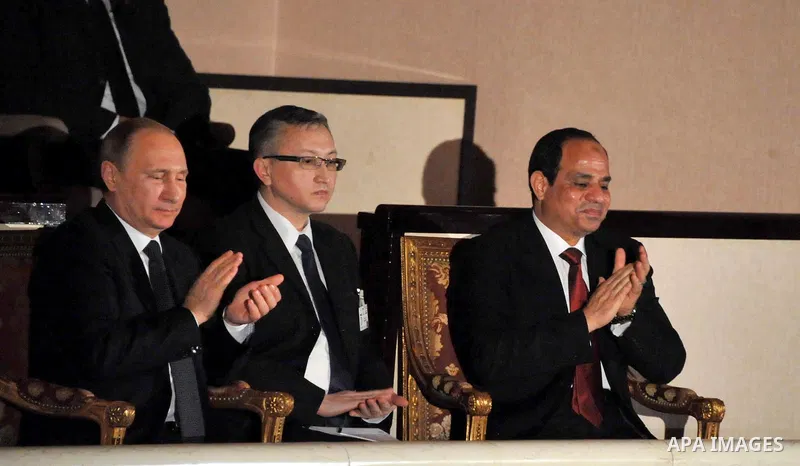 A handout picture released on February 9, 2015 by the Egyptian Presidency shows Egyptian President Abdel Fattah al-Sisi (R) and his Russian counterpart Vladimir Putin (L), attend a concert at the Egyptian capital's Opera...