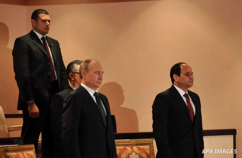 A handout picture released on February 9, 2015 by the Egyptian Presidency shows Egyptian President Abdel Fattah al-Sisi (R) and his Russian counterpart Vladimir Putin (L), attend a concert at the Egyptian capital's Opera...