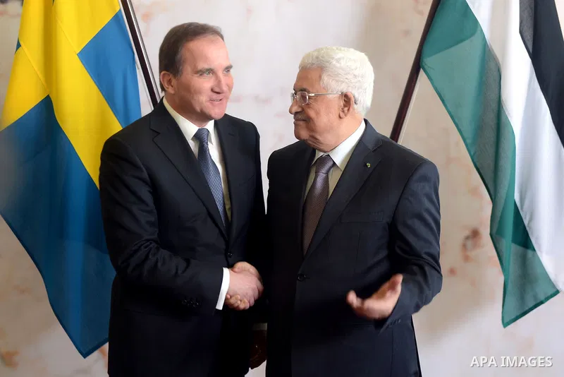 Prime Minister of Sweden Stefan Loefven (R) and Palestinian President Mahmoud Abbas shake hands during a joint press conference in the Bella Venezia room at the Rosenbad government office in Stockholm on February 10, 201...