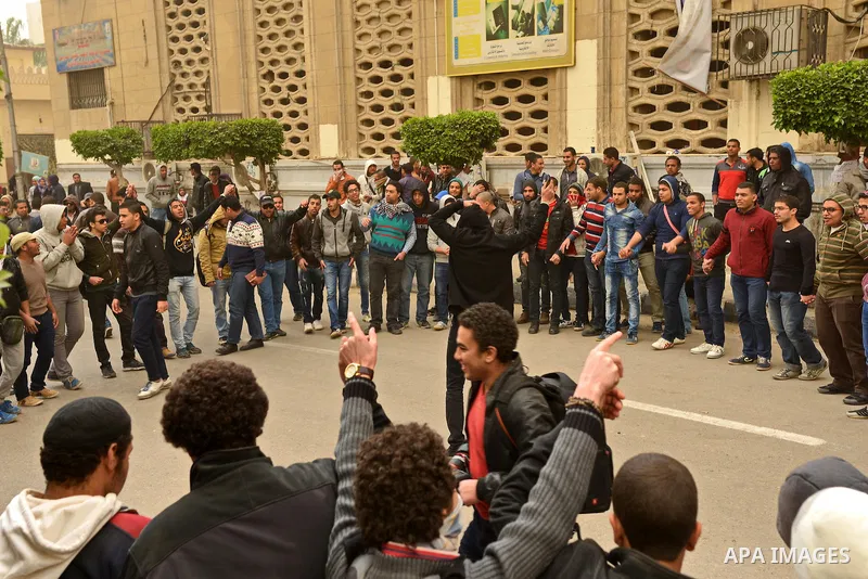 Egyptian students who are support ousted President Mohamed Morsi and the Muslim Brotherhood take part in a protest in Cairo University on February 11, 2015. Due to the escalation of students protest in the campus of seve...