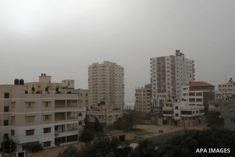 A sandstorm is seen over Gaza city on February 11, 2015. Photo by Mohammed Asad
