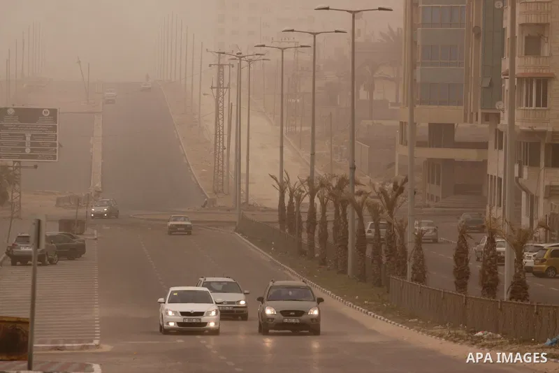 A sandstorm is in a street in Gaza city on February 11, 2015. Photo by Mohammed Asad