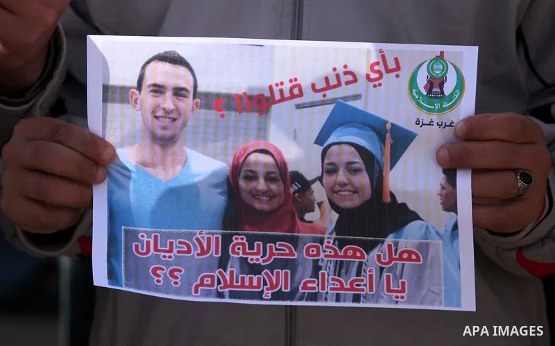 Palestinians take part in a protest against the murders of three Muslim students in Carolina, outside the UN headquarters in Gaza city on February 12, 2015. Craig Stephen Hicks, 46, has been charged with three counts of...