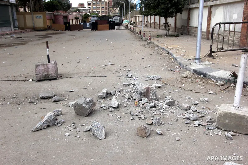 The damage is seen at site of a bomb blast in front of a police station in the Ain Shams area in Cairo, 13 February 2015. Attacks on security forces have become common in Egypt, which is currently battling an insurgency...