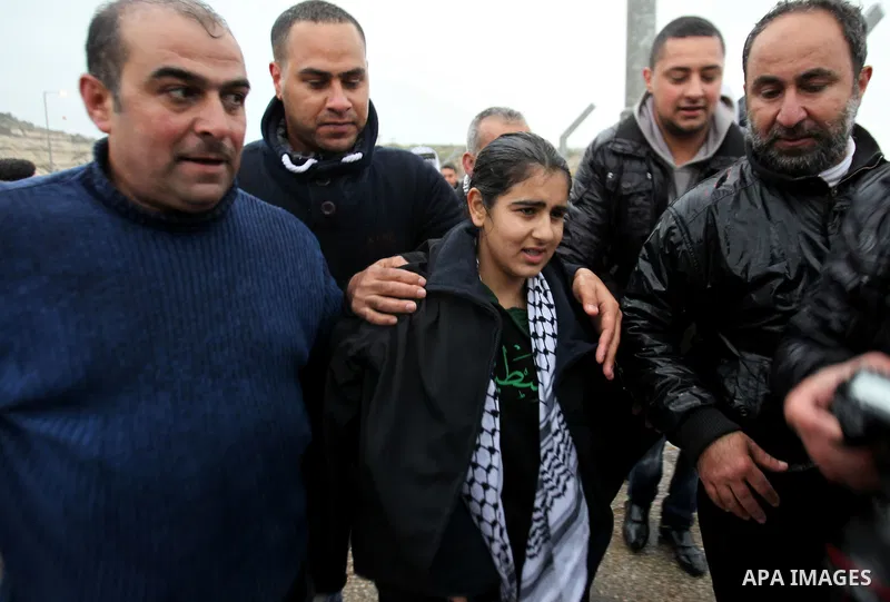 Palestinian 14-year-old schoolgirl Malak al-Khatib is greeted by relatives after her release from an Israeli jail, in the West Bank Palestinian village of Tulkarem on February 13, 2015. Israel freed Malak, whose jailing...