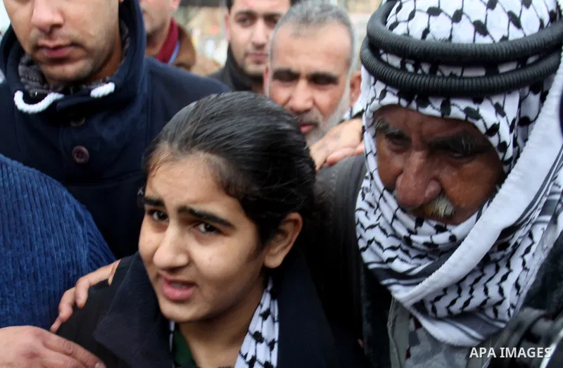 Palestinian 14-year-old schoolgirl Malak al-Khatib is greeted by relatives after her release from an Israeli jail, in the West Bank Palestinian village of Tulkarem on February 13, 2015. Israel freed Malak, whose jailing...