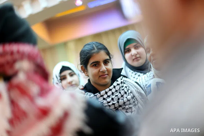 Palestinian 14-year-old schoolgirl Malak al-Khatib is greeted by relatives during a ceremony after her release from an Israeli jail, in the West Bank city of Ramallah on February 13, 2015. Israel freed Malak, whose jaili...