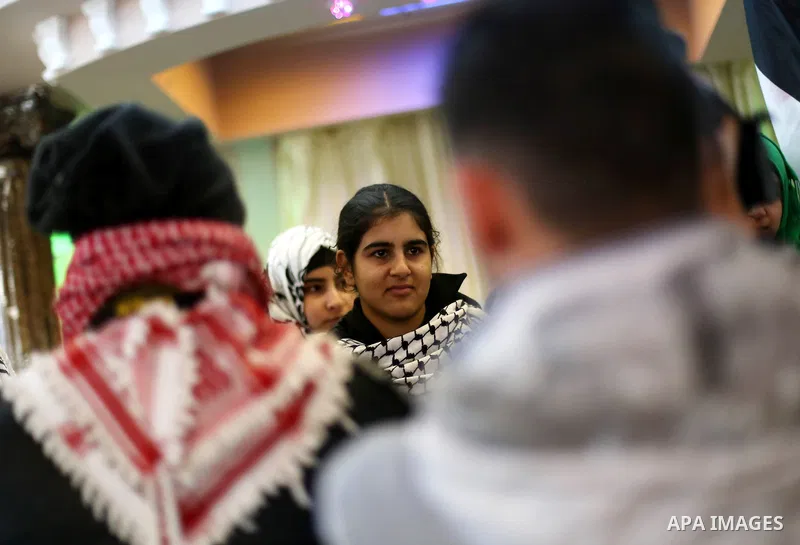 Palestinian 14-year-old schoolgirl Malak al-Khatib is greeted by relatives during a ceremony after her release from an Israeli jail, in the West Bank city of Ramallah on February 13, 2015. Israel freed Malak, whose jaili...