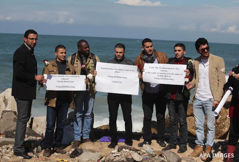 Palestinians gather to remember the Chapel Hill shooting victims, the three young Muslims who were gunned down in North Carolina this week, in Gaza City, February 14, 2015. Newlywed Deah Shaddy Barakat, 23, a University...
