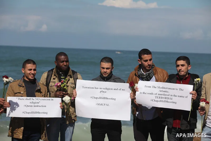 Palestinians gather to remember the Chapel Hill shooting victims, the three young Muslims who were gunned down in North Carolina this week, in Gaza City, February 14, 2015. Newlywed Deah Shaddy Barakat, 23, a University...
