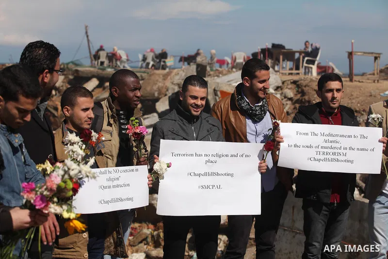 Palestinians gather to remember the Chapel Hill shooting victims, the three young Muslims who were gunned down in North Carolina this week, in Gaza City, February 14, 2015. Newlywed Deah Shaddy Barakat, 23, a University...