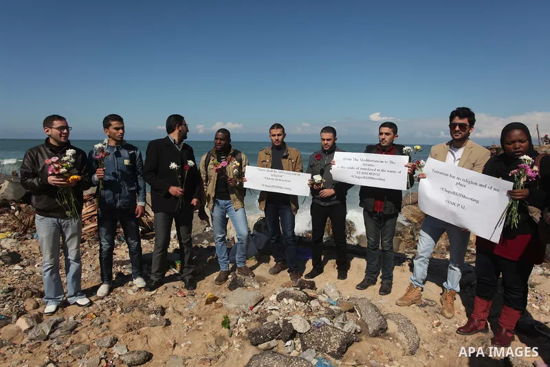 Palestinians gather to remember the Chapel Hill shooting victims, the three young Muslims who were gunned down in North Carolina this week, in Gaza City, February 14, 2015. Newlywed Deah Shaddy Barakat, 23, a University...