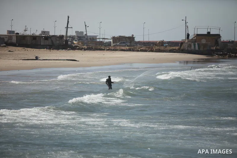 A Palestinian man throws his net at the sea of Gaza City, on February 14, 2015. Three young Muslims were gunned down in Chapel Hill, North Carolina, this week. Newlywed Deah Shaddy Barakat, 23, a University of North Caro...