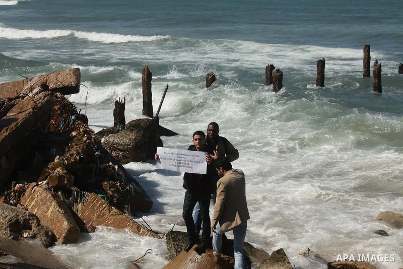 Palestinians gather to remember the Chapel Hill shooting victims, the three young Muslims who were gunned down in North Carolina this week, in Gaza City, February 14, 2015. Newlywed Deah Shaddy Barakat, 23, a University...