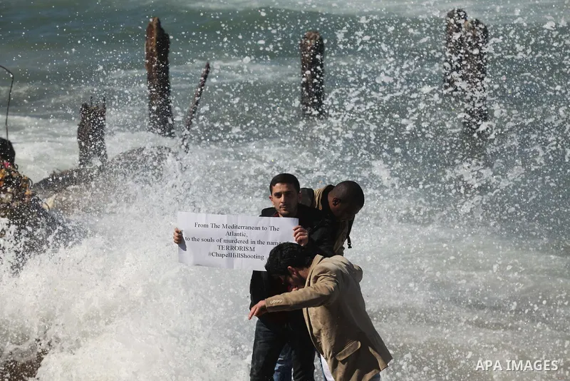 Palestinians gather to remember the Chapel Hill shooting victims, the three young Muslims who were gunned down in North Carolina this week, in Gaza City, February 14, 2015. Newlywed Deah Shaddy Barakat, 23, a University...
