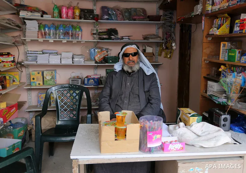 A Palestinian man displays goods at his shop in Rafah in the southern Gaza strip, on February 14, 2015. Refugee unemployment in Gaza reached 45.5% in the second quarter of 2014, the highest level ever reported in UNRWA’s...