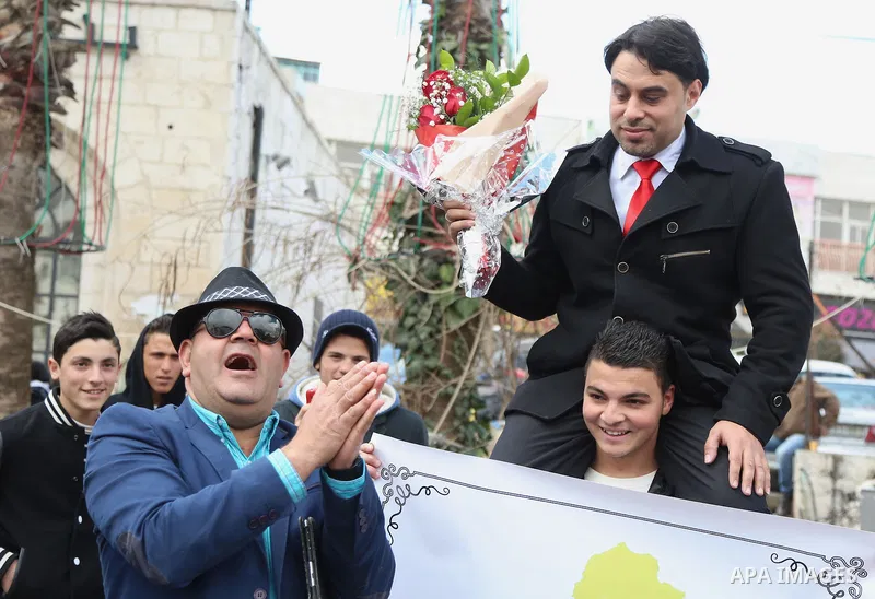 A Palestinian Rashid fedda, 35,speaks to media to demand the President Mahmoud Abbas for help him in reuniting with his fiancee, Dalia from Gaza City, during a protest, at Manara square in the West Bank town of Ramallah,...
