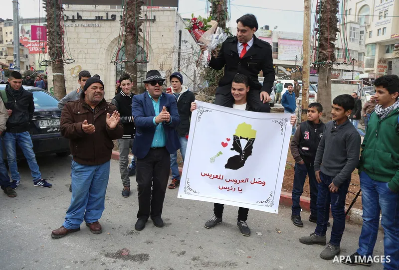 A Palestinian Rashid fedda, 35,speaks to media to demand the President Mahmoud Abbas for help him in reuniting with his fiancee, Dalia from Gaza City, during a protest, at Manara square in the West Bank town of Ramallah,...