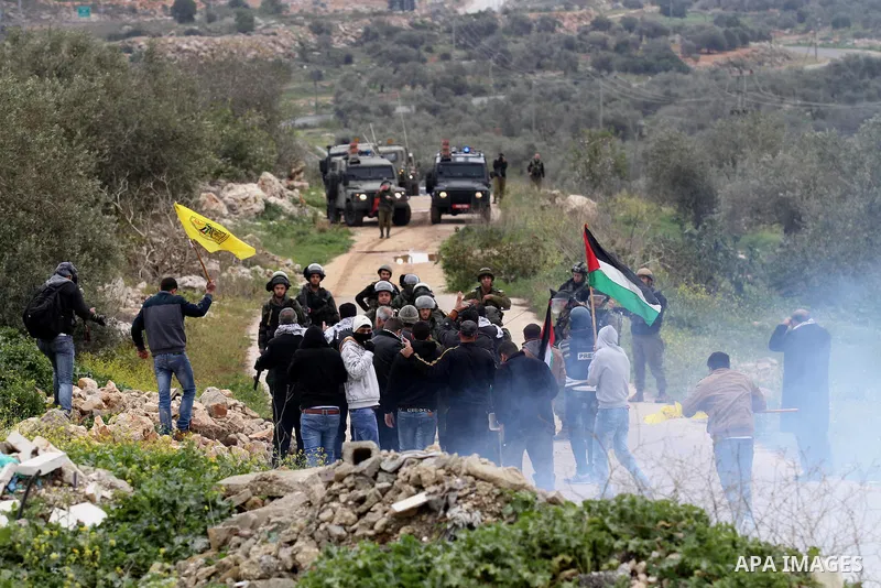 Palestinian protesters clashes with Israeli border policemen following a protest against closure of the village road, in the West Bank village of Azzun near Qalqilya February 14, 2015. Photo by Nedal Eshtayah