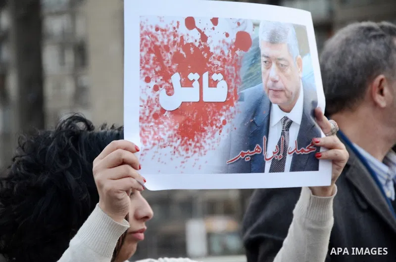 Members of the April 6 movement hold placards during a demonstration of October bridge in Cairo, Egypt on February 14, 2015. Photo by Amr Sayed