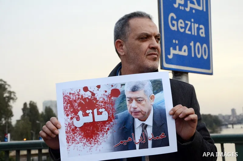 Members of the April 6 movement hold placards during a demonstration of October bridge in Cairo, Egypt on February 14, 2015. Photo by Amr Sayed