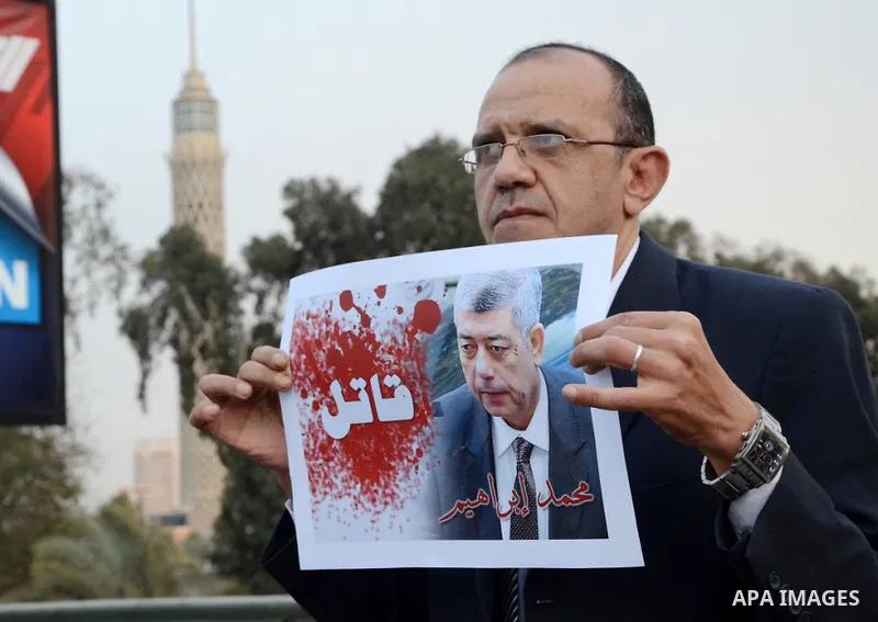 Members of the April 6 movement hold placards during a demonstration of October bridge in Cairo, Egypt on February 14, 2015. Photo by Amr Sayed