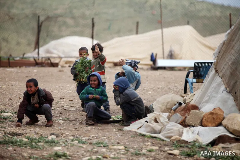 Palestinian children play outside their tents in the West Bank Beduin village of Almaleh, in the northern Jordan Valley February 14, 2015. Photo by Shadi Hatem