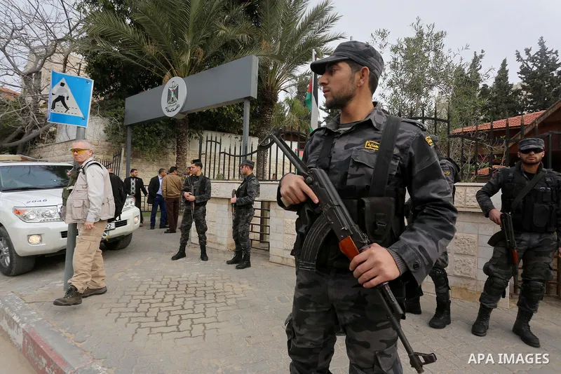 Palestinian policemen stand guard during a visiting of the Middle East Quartet envoy Tony Blair leaves in Gaza city on February 15, 2015. Blair is in Gaza for meetings with officials about the reconstruction of the terri...